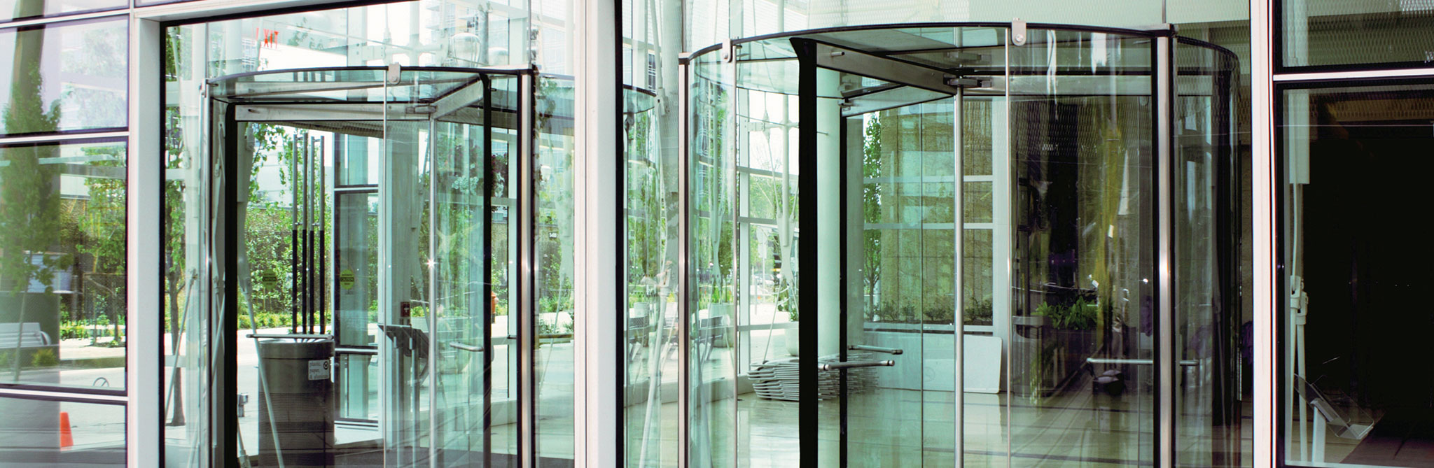 Glass revolving door at the entrance of a modern building. 