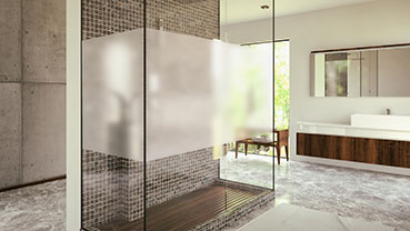 Bathroom with a tiled shower enclosure and frosted privacy band.