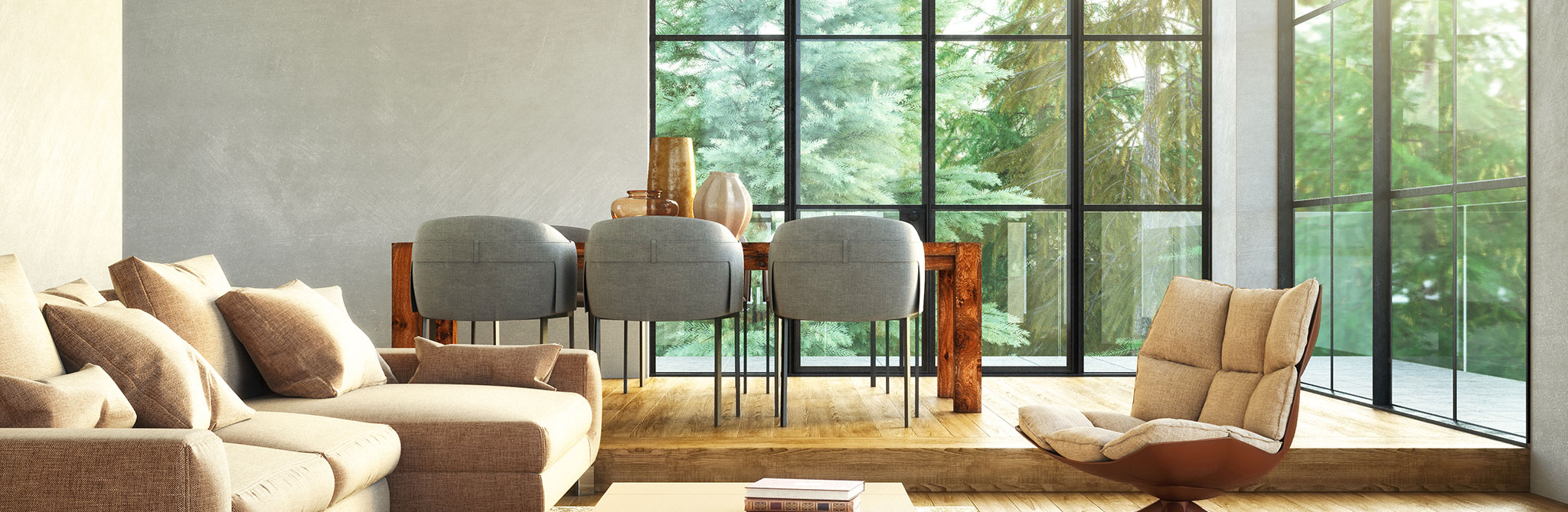 Bright living and dining area with large windows overlooking greenery. 